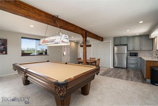 9704 River Rd, Bozeman, MT 59718 - playroom with a sink, dark carpet, beamed ceiling, recessed lighting, and baseboards