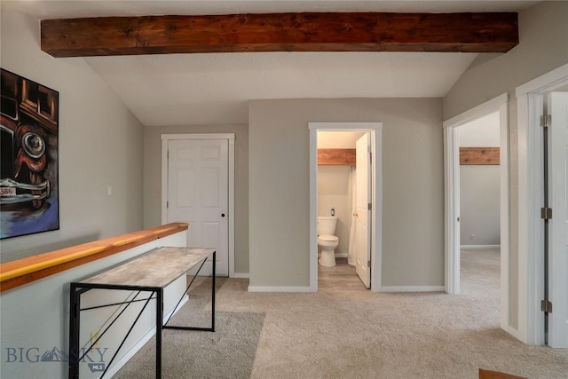 9704 River Rd, Bozeman, MT 59718 - corridor featuring beamed ceiling, light carpet, and baseboards