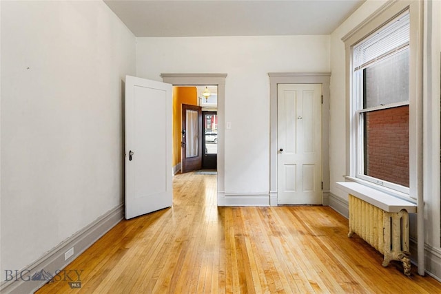822 W Park St, Butte, MT 59701 - unfurnished bedroom featuring light wood-style flooring, multiple windows, and baseboards