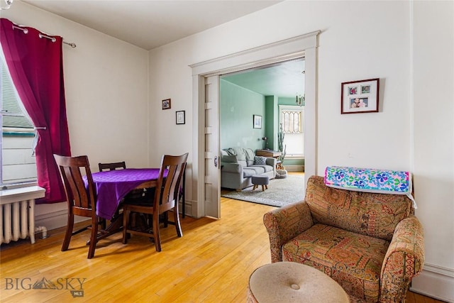 822 W Park St, Butte, MT 59701 - dining space featuring light wood-style floors and radiator heating unit