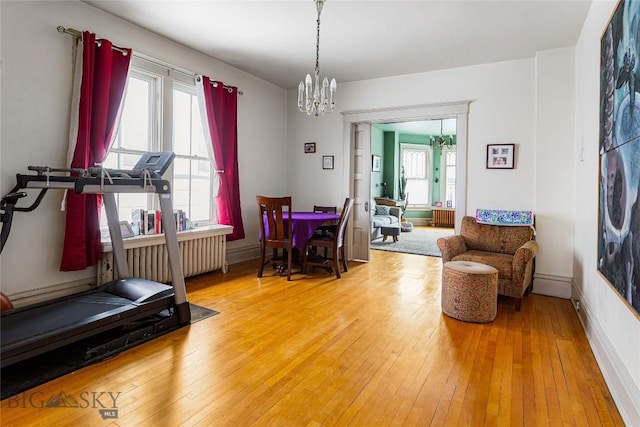 822 W Park St, Butte, MT 59701 - dining space featuring a chandelier, wood-type flooring, and baseboards
