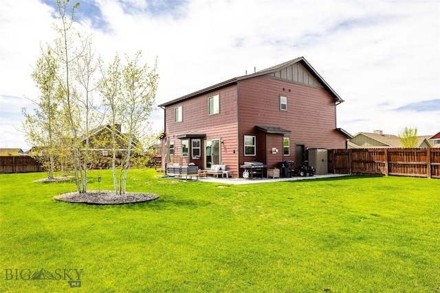 1602 Ingomar Blvd, Belgrade, MT 59714 - back of property featuring board and batten siding and a patio