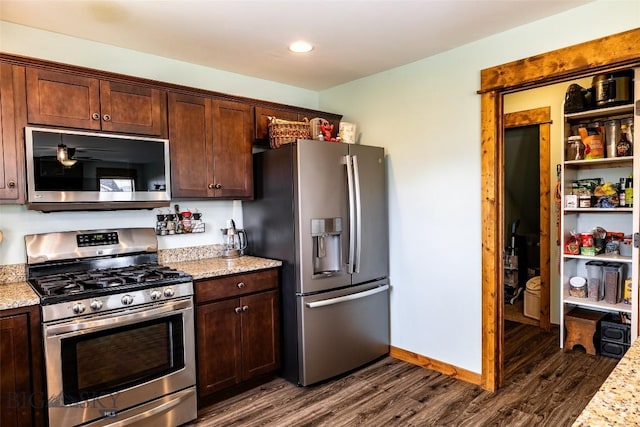 1602 Ingomar Blvd, Belgrade, MT 59714 - kitchen with appliances with stainless steel finishes, dark wood-type flooring, light stone counters, and recessed lighting