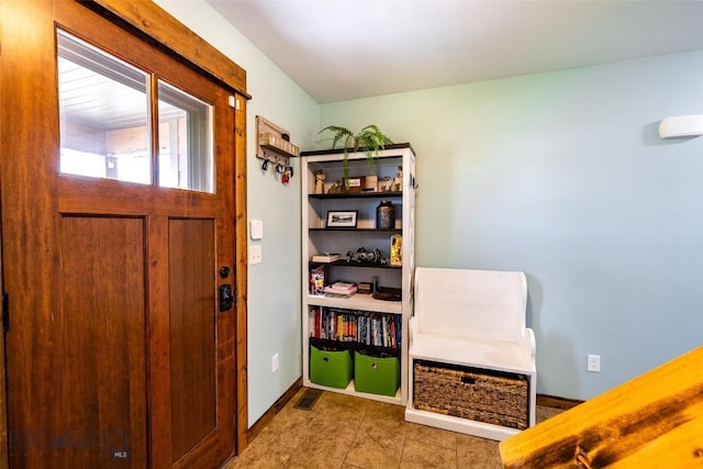 1602 Ingomar Blvd, Belgrade, MT 59714 - tiled entryway featuring baseboards