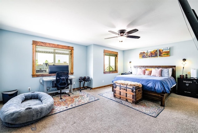 1602 Ingomar Blvd, Belgrade, MT 59714 - bedroom featuring carpet floors, multiple windows, an office area, and a ceiling fan