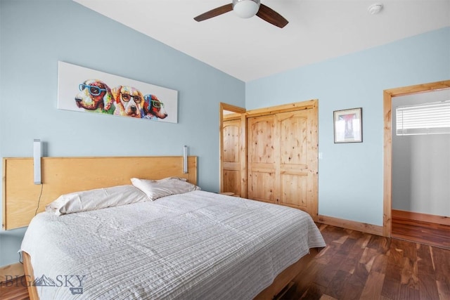 bedroom with wood finished floors, baseboards, and a ceiling fan
