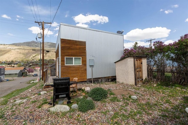 view of shed with a mountain view