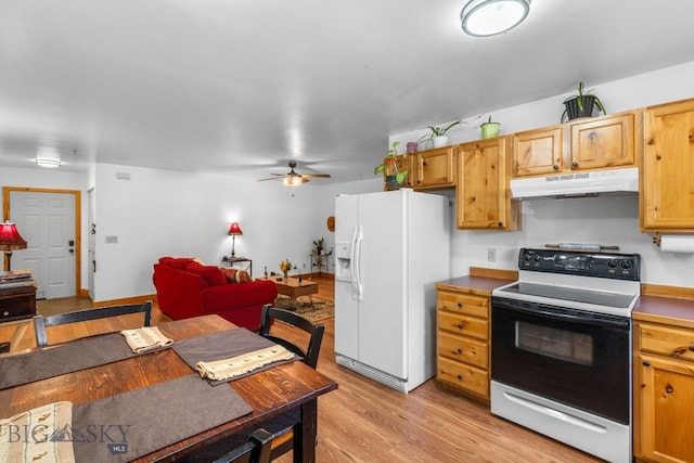 kitchen with white refrigerator with ice dispenser, under cabinet range hood, electric stove, light wood-style floors, and ceiling fan