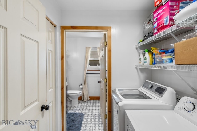 clothes washing area with washer and dryer