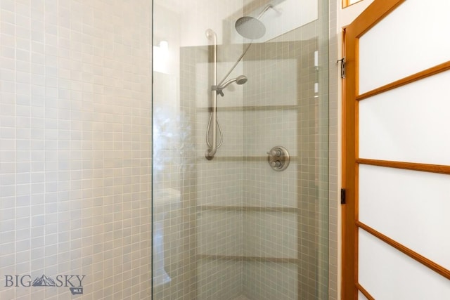 bathroom with a tile shower