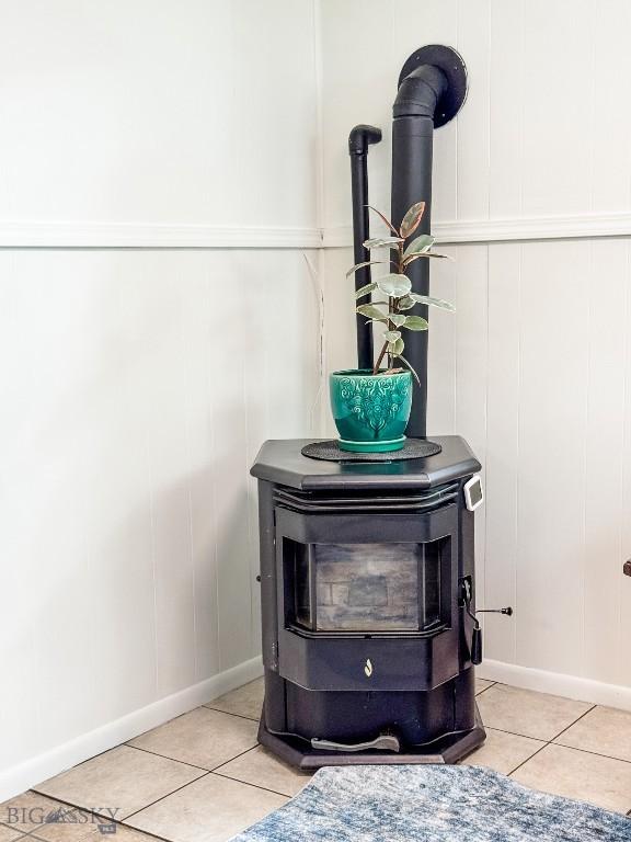607 Meadowlark Ln, Livingston, MT 59047 - detailed view of a wood stove, a decorative wall, and baseboards