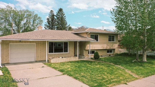 607 Meadowlark Ln, Livingston, MT 59047 - tri-level home featuring an attached garage, driveway, a front lawn, a chimney, and brick siding