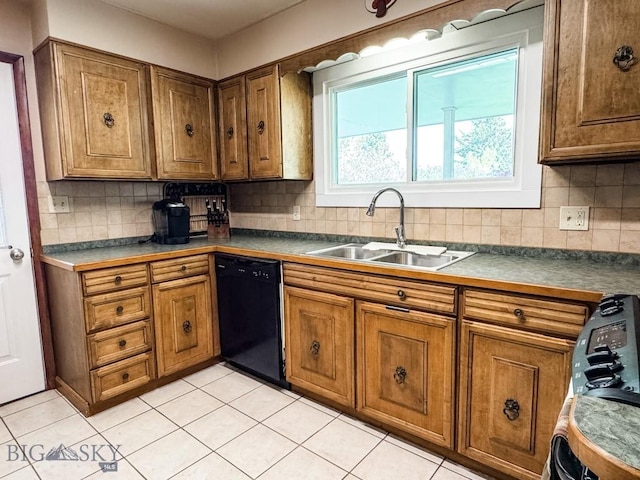 607 Meadowlark Ln, Livingston, MT 59047 - kitchen with dishwasher, a sink, brown cabinetry, tasteful backsplash, and light tile patterned flooring