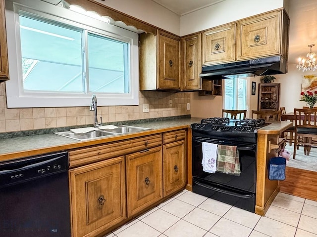 607 Meadowlark Ln, Livingston, MT 59047 - kitchen featuring black appliances, under cabinet range hood, a sink, brown cabinetry, and tasteful backsplash