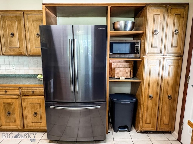 607 Meadowlark Ln, Livingston, MT 59047 - kitchen with appliances with stainless steel finishes, brown cabinets, open shelves, and light tile patterned floors