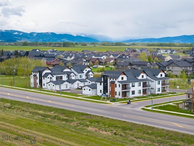 aerial view of residential area featuring mountains