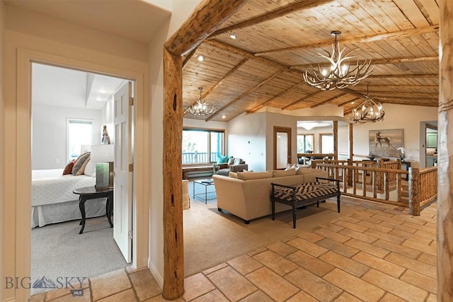 952 N Meadow Creek Rd, Mcallister, MT 59740 - living area with a chandelier, wooden ceiling, light colored carpet, and vaulted ceiling