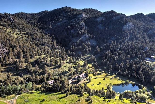 952 N Meadow Creek Rd, Mcallister, MT 59740 - mountain view with a heavily wooded area and a nearby body of water