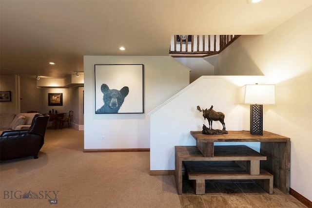 stairway with recessed lighting, baseboards, and carpet
