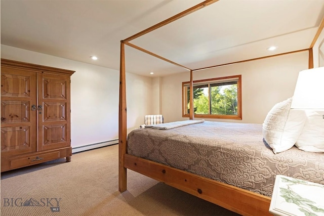 carpeted bedroom featuring a baseboard heating unit and recessed lighting