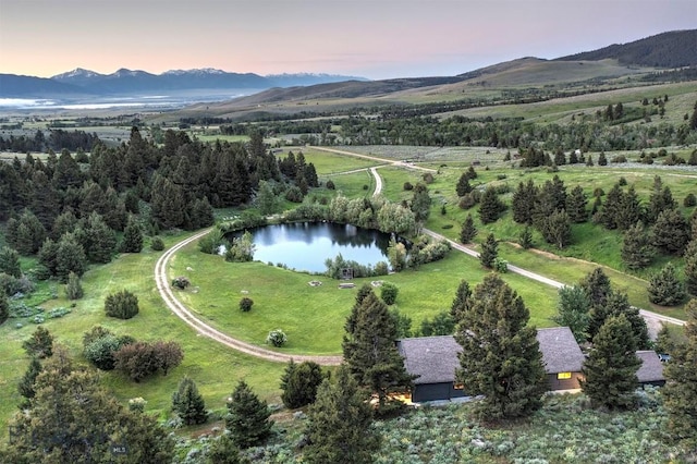 drone / aerial view of a water and mountain view