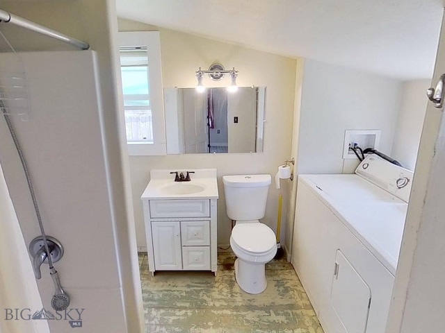 401 E 2nd Ave, Big Timber, MT 59011 - bathroom with washing machine and dryer, vanity, toilet, and lofted ceiling