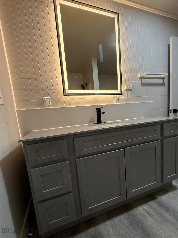 1820 Utah, Butte, MT 59701 - bathroom with tile walls, vanity, and tasteful backsplash