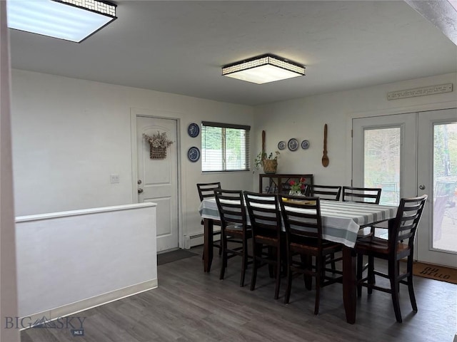 dining room with dark wood-style floors, french doors, and baseboards