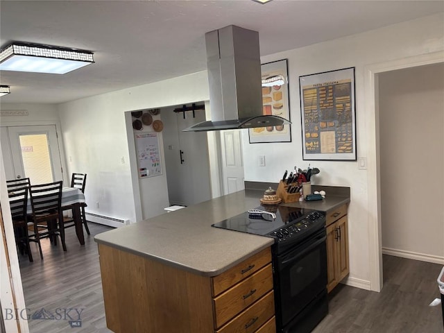 kitchen with black range with electric stovetop, island exhaust hood, dark wood-type flooring, a peninsula, and baseboards