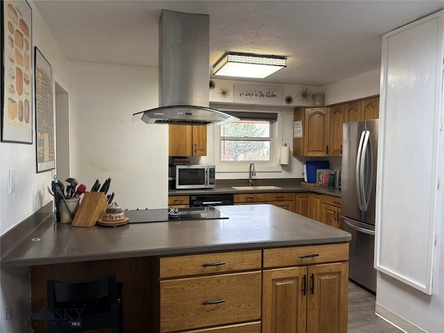 kitchen featuring black appliances, island exhaust hood, and brown cabinetry