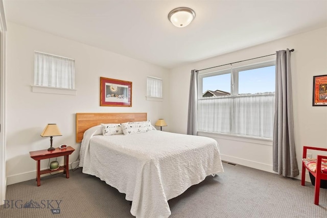 bedroom with carpet flooring and baseboards