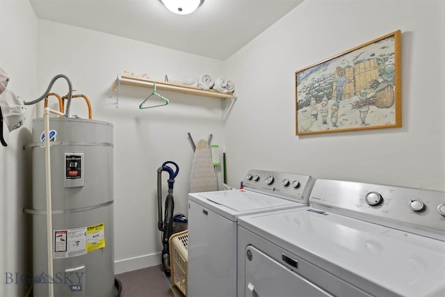 laundry area with water heater, separate washer and dryer, and baseboards