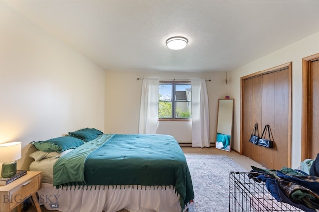 bedroom featuring light colored carpet