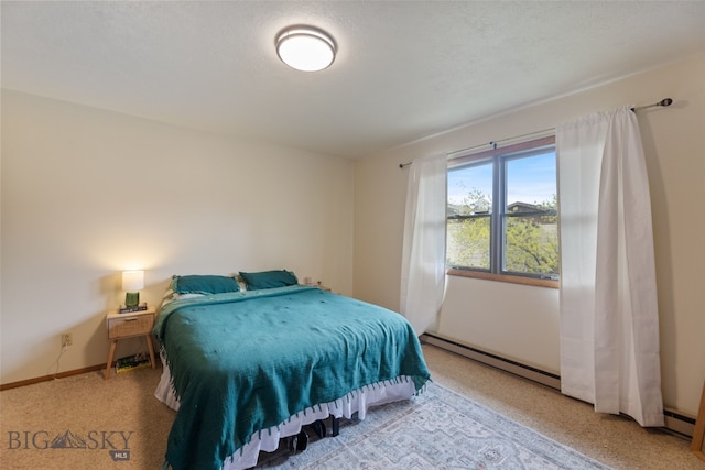 bedroom featuring a baseboard radiator and baseboards