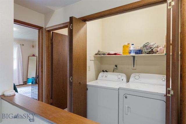 washroom with washer and dryer