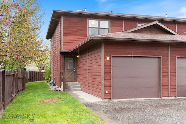 view of front of house with driveway, entry steps, and a garage
