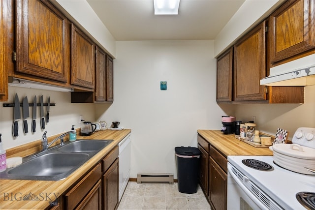 kitchen with white appliances, a sink, under cabinet range hood, wood counters, and baseboards
