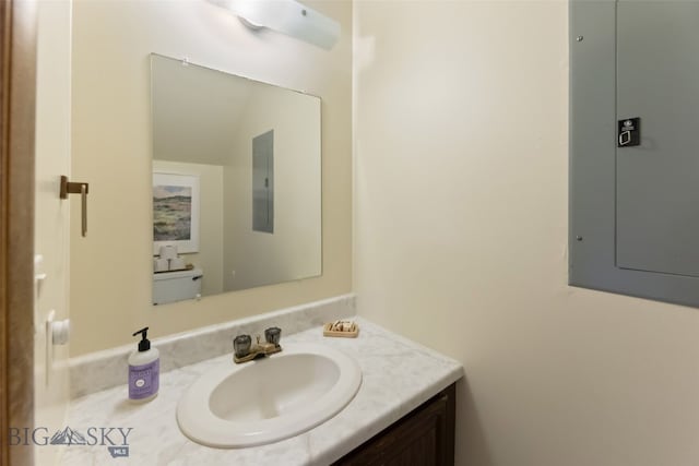 half bath featuring electric panel and vanity