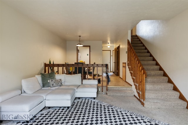 living room with stairway and carpet floors