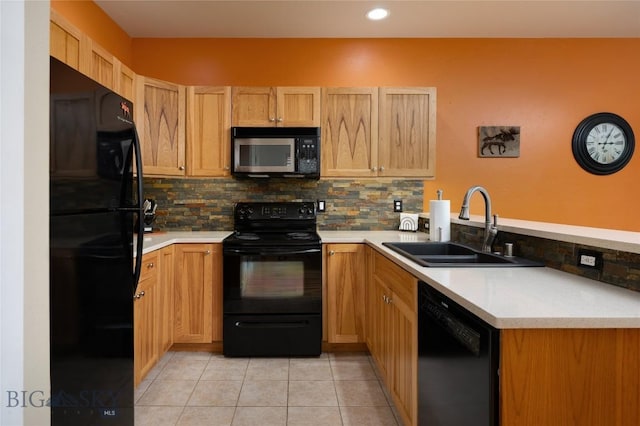 128 Droulliard Ave, Bozeman, MT 59718 - kitchen with black appliances, a sink, a peninsula, backsplash, and recessed lighting