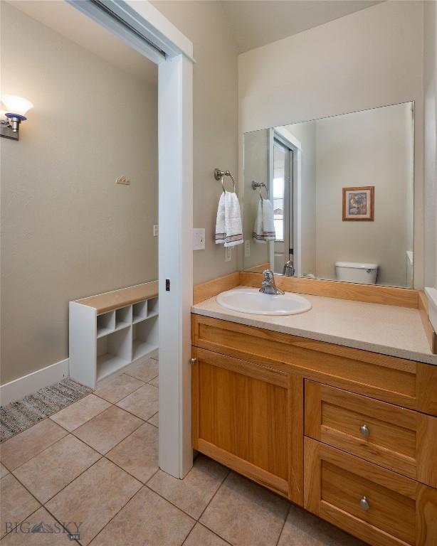 128 Droulliard Ave, Bozeman, MT 59718 - bathroom featuring tile patterned floors, vanity, and toilet