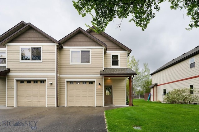 128 Droulliard Ave, Bozeman, MT 59718 - view of front facade featuring driveway, a garage, and a front yard