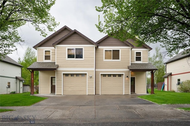 128 Droulliard Ave, Bozeman, MT 59718 - craftsman inspired home featuring a garage, driveway, and a front lawn