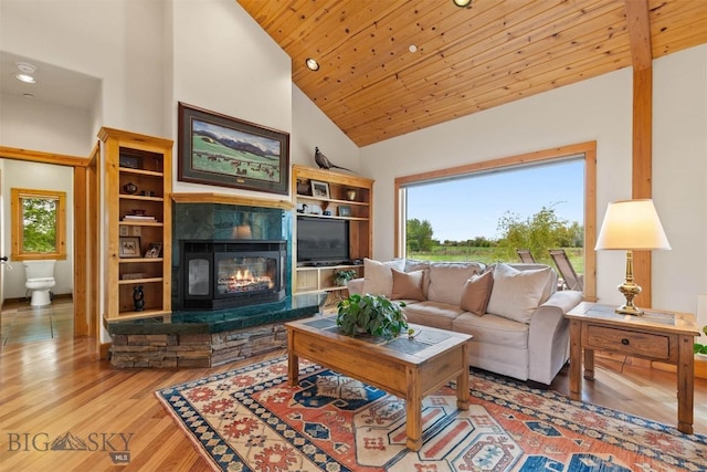 64 Shandalyn Ln, Bozeman, MT 59718 - living area with wood finished floors, high vaulted ceiling, wood ceiling, a stone fireplace, and recessed lighting