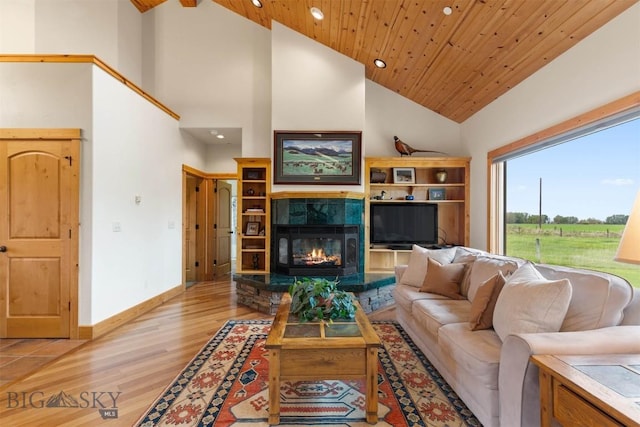 64 Shandalyn Ln, Bozeman, MT 59718 - living room featuring high vaulted ceiling, recessed lighting, light wood finished floors, a fireplace, and wood ceiling