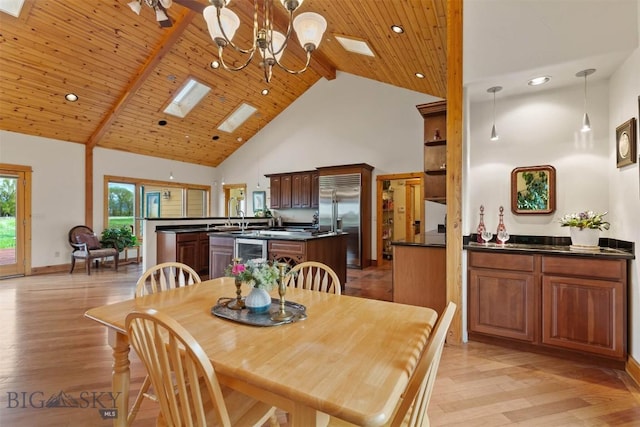 64 Shandalyn Ln, Bozeman, MT 59718 - dining space featuring a skylight, high vaulted ceiling, wood ceiling with exposed beams, a chandelier, and light wood-style floors
