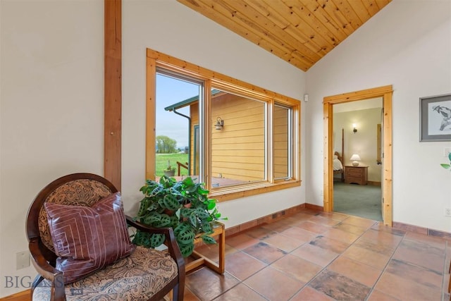 64 Shandalyn Ln, Bozeman, MT 59718 - sitting room featuring lofted ceiling, tile patterned floors, and baseboards