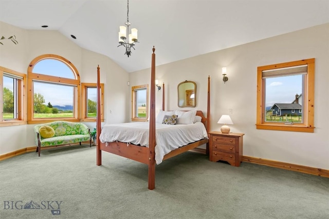 64 Shandalyn Ln, Bozeman, MT 59718 - bedroom featuring multiple windows, carpet, a chandelier, vaulted ceiling, and baseboards