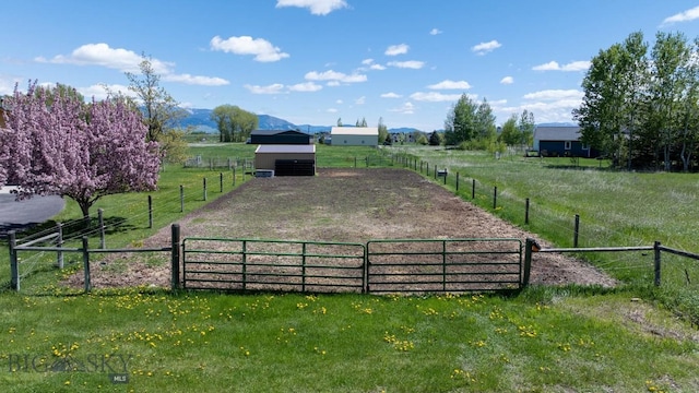 64 Shandalyn Ln, Bozeman, MT 59718 - view of yard featuring a view of rural / pastoral area, an outbuilding, and an enclosed riding area