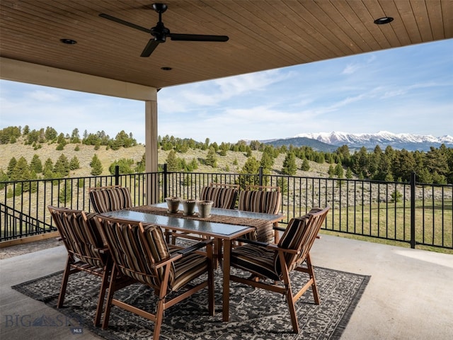 449 Minni Hall Rd, Bozeman, MT 59715 - view of patio featuring ceiling fan, outdoor dining space, and a mountain view